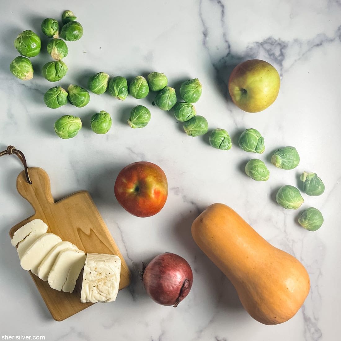 apples onions brussels sprouts butternut squash and halloumi cheese