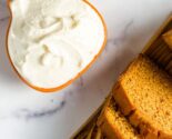 sliced pumpkin bread and cream cheese frosting