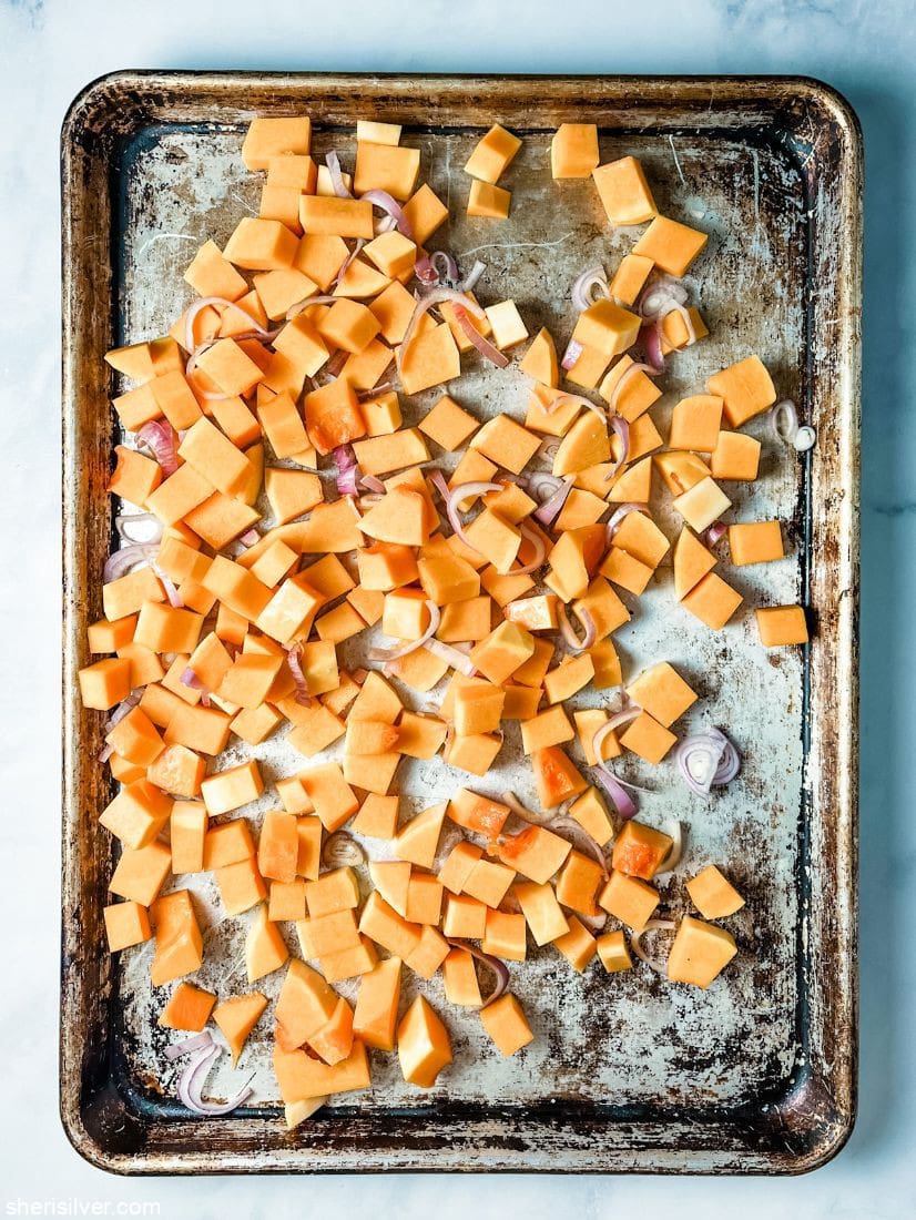 butternut squash and shallots on metal sheet pan
