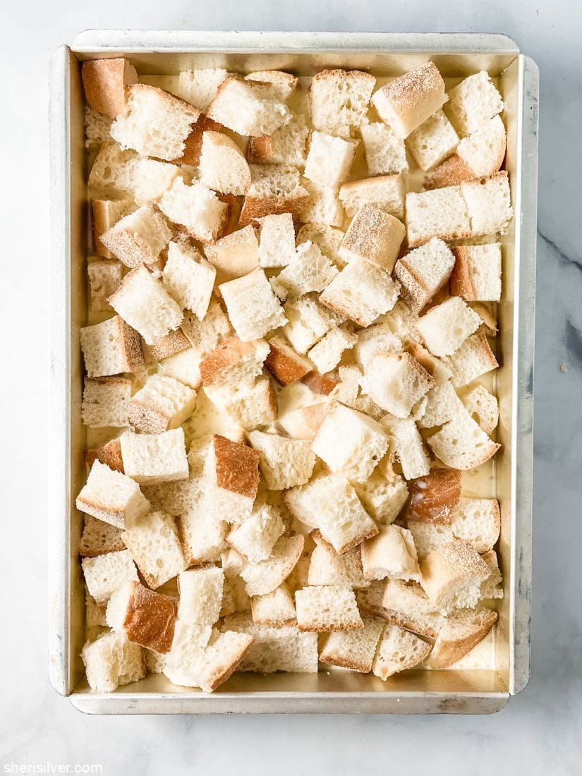 bread cubes and egg mixture in a baking pan