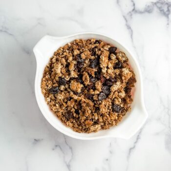 maple granola with dried cherries in a pyrex bowl