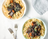 short ribs in red wine gravy with buttered noodles in ceramic bowls
