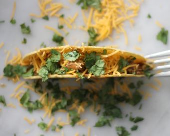 use a fork to keep a taco shell upright