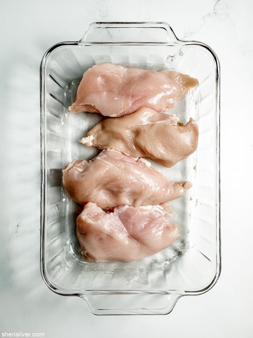 boneless chicken breasts in a glass baking dish