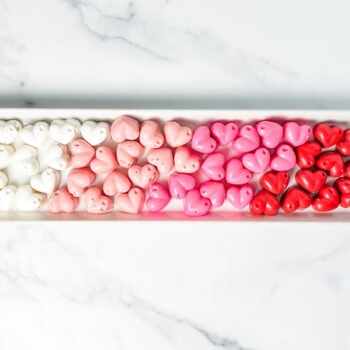 pink ombre chocolate hearts on a white tray