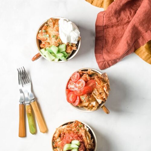 sheet pan chicken nachos in serving mugs