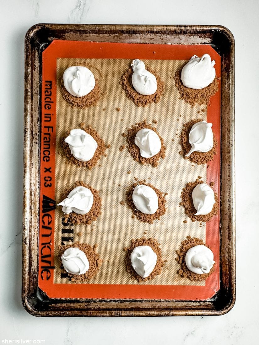 biscoff meringues on a silpat lined sheet pan