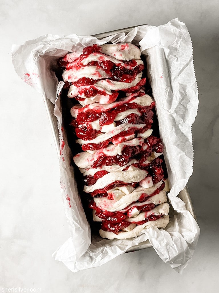 cranberry brie pull apart loaf in a loaf pan