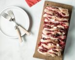 cranberry brie pull apart loaf on a wooden board