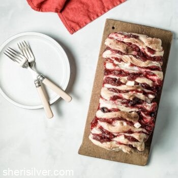cranberry brie pull apart loaf on a wooden board