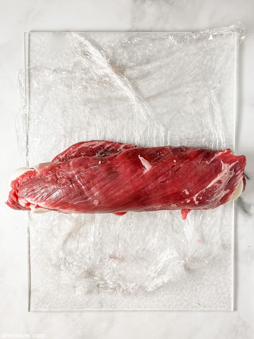 beef pinwheel on clear cutting board