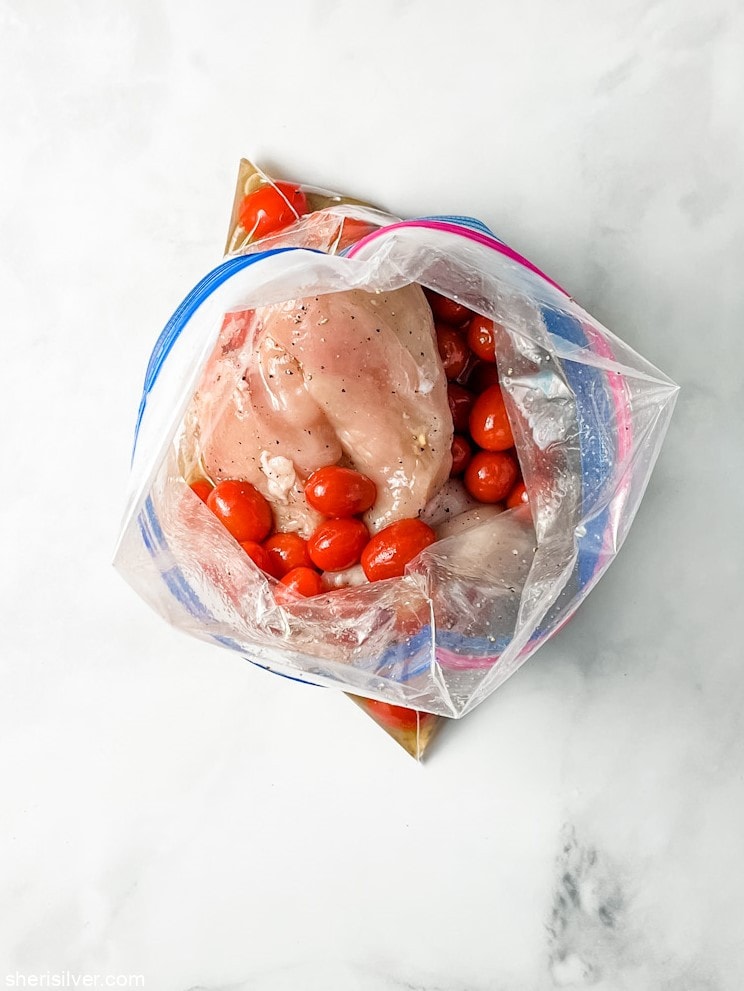 chicken and tomatoes in a ziploc bag