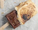 s'mores popsicle on a parchment lined wire rack