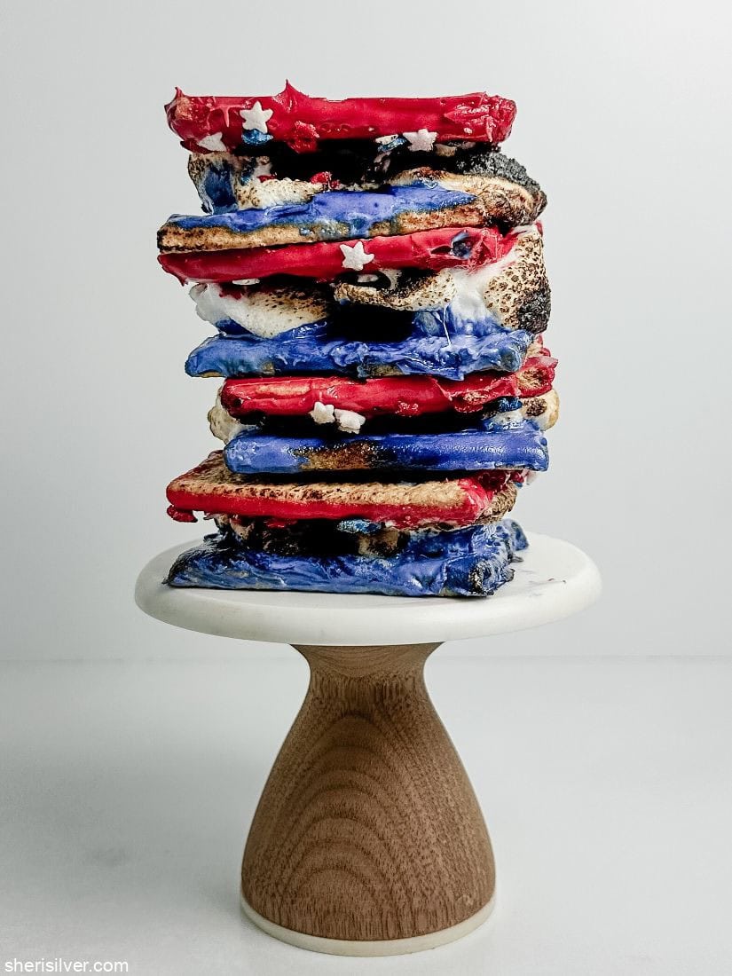 red white and blue smores stacked on a mini cake stand