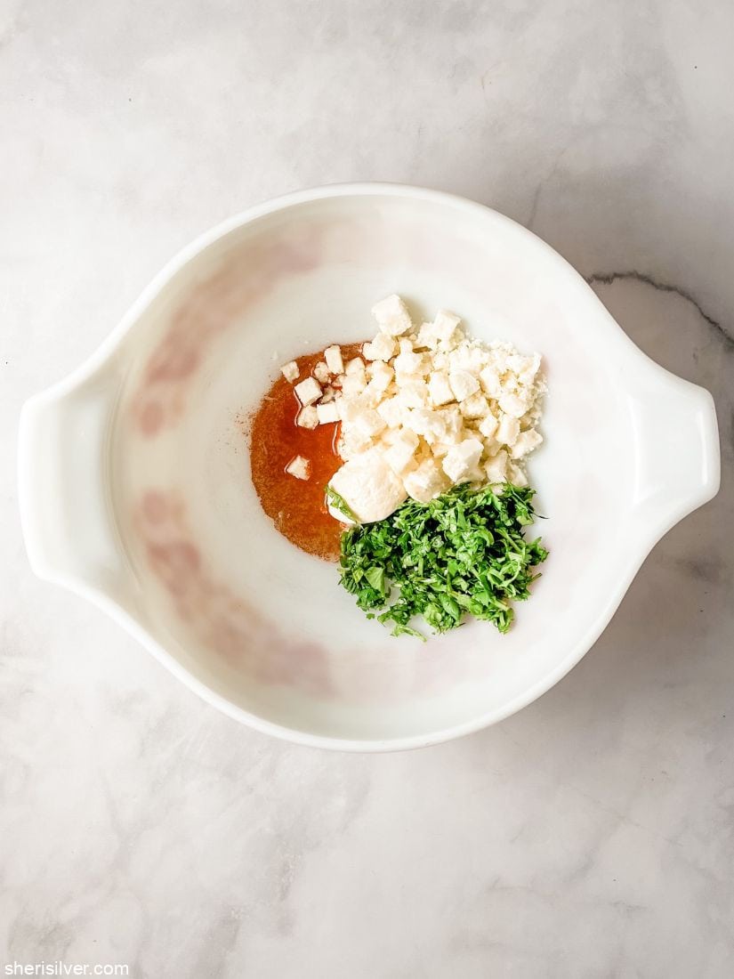 esquites ingredients in a vintage pyrex bowl