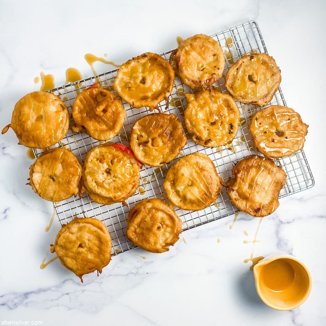 fried apple slices with honey glaze on wire rack