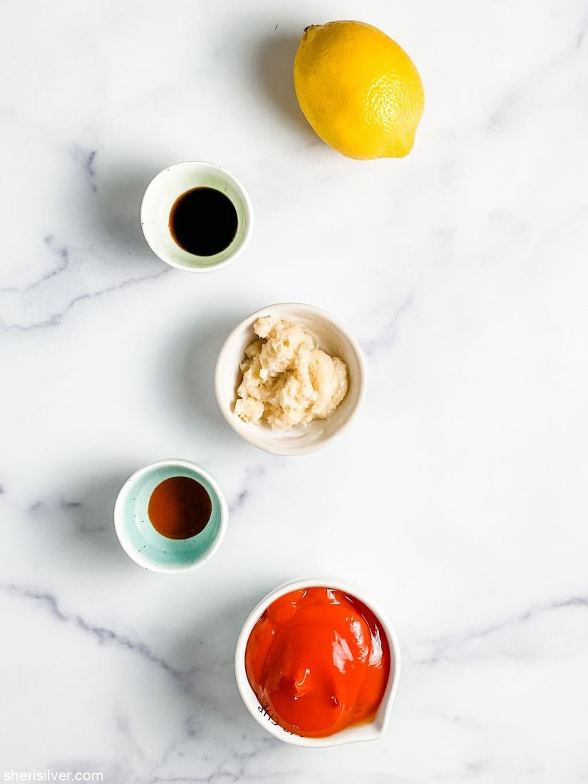 bowl of ketchup with horseradish and lemon