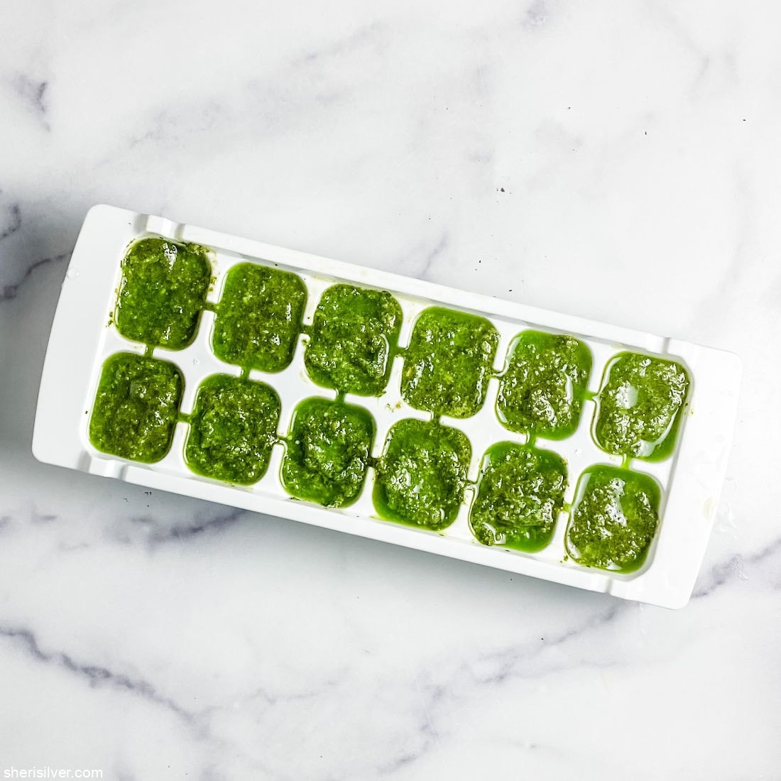 pesto in ice cube tray