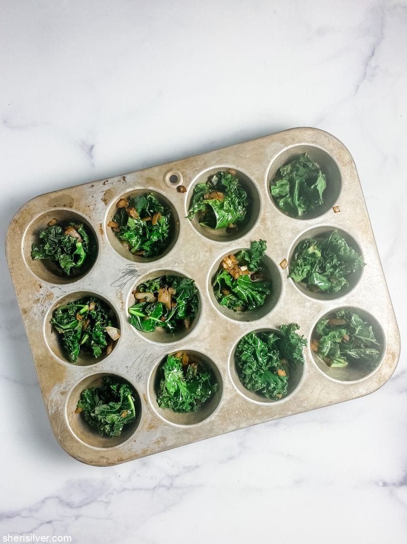 kale and bacon in muffin tins