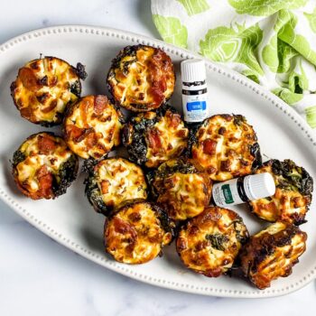 mini bacon kale frittatas on serving platter with essential oils