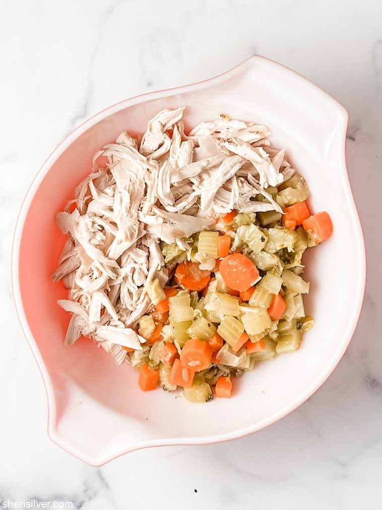 chopped chicken and vegetables in a pyrex bowl