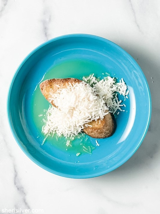 parmesan toast in a blue bowl