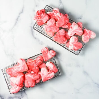 marbled icing heart cookies on a wire rack