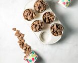 churro muddy buddies in polka dot cups in a ceramic muffin tin