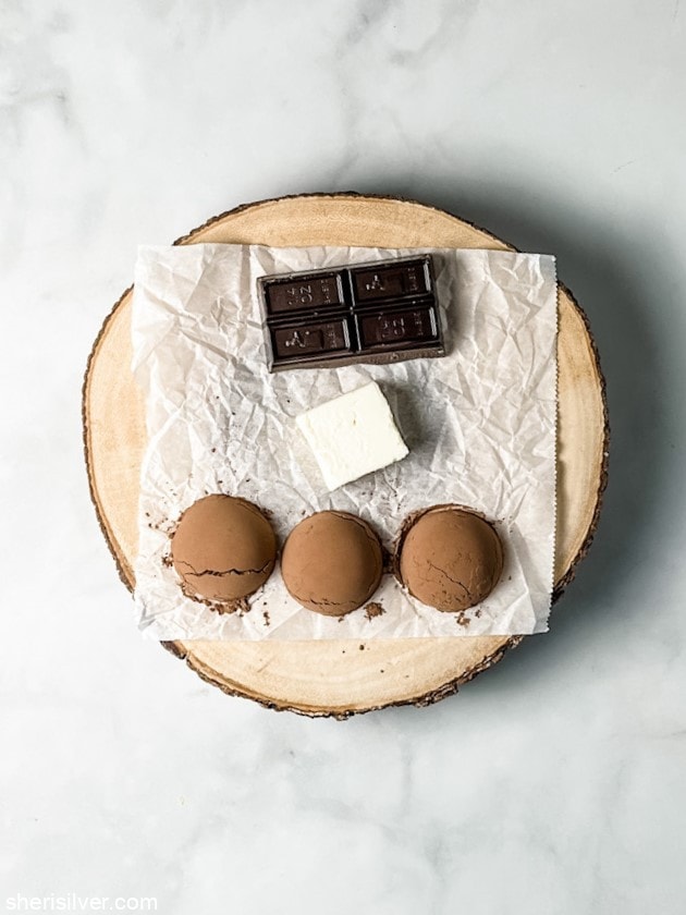 unsweetened chocolate with butter and cocoa powder on a wooden cake stand
