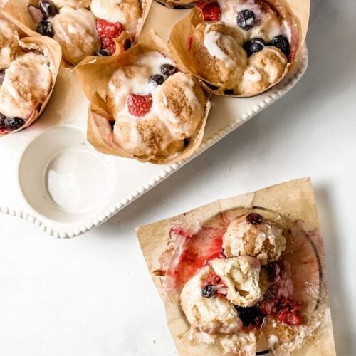 red white and blue monkey bread muffins in a white ceramic muffin tin