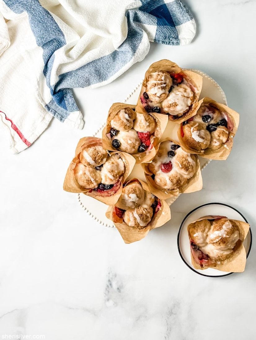 red white and blue monkey bread muffins in a white ceramic muffin tin