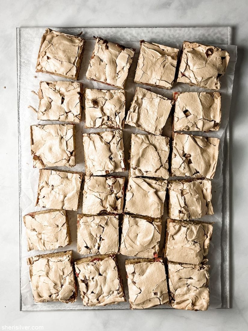rhubarb mud hen bars on a clear cutting board