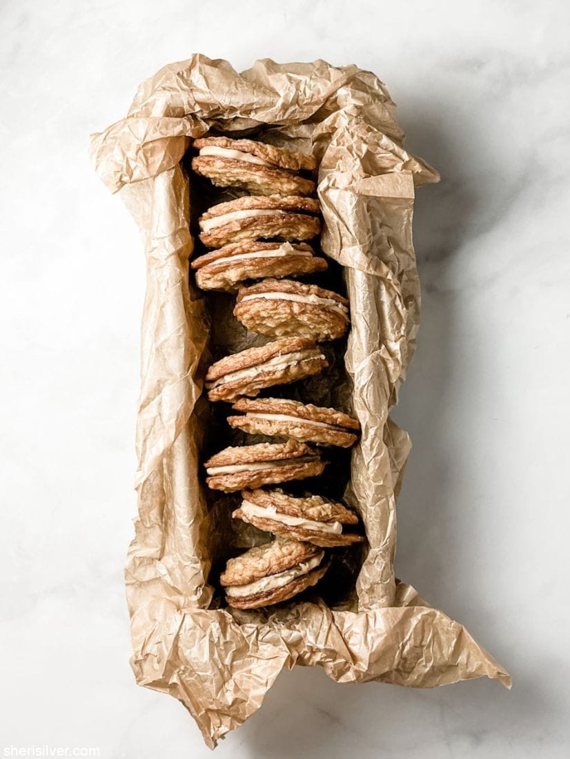 tahini oat sandwich cookies in a parchment lined loaf pan