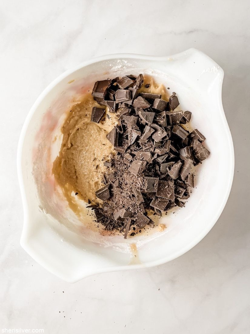 chocolate chunk cookie dough in a pyrex bowl