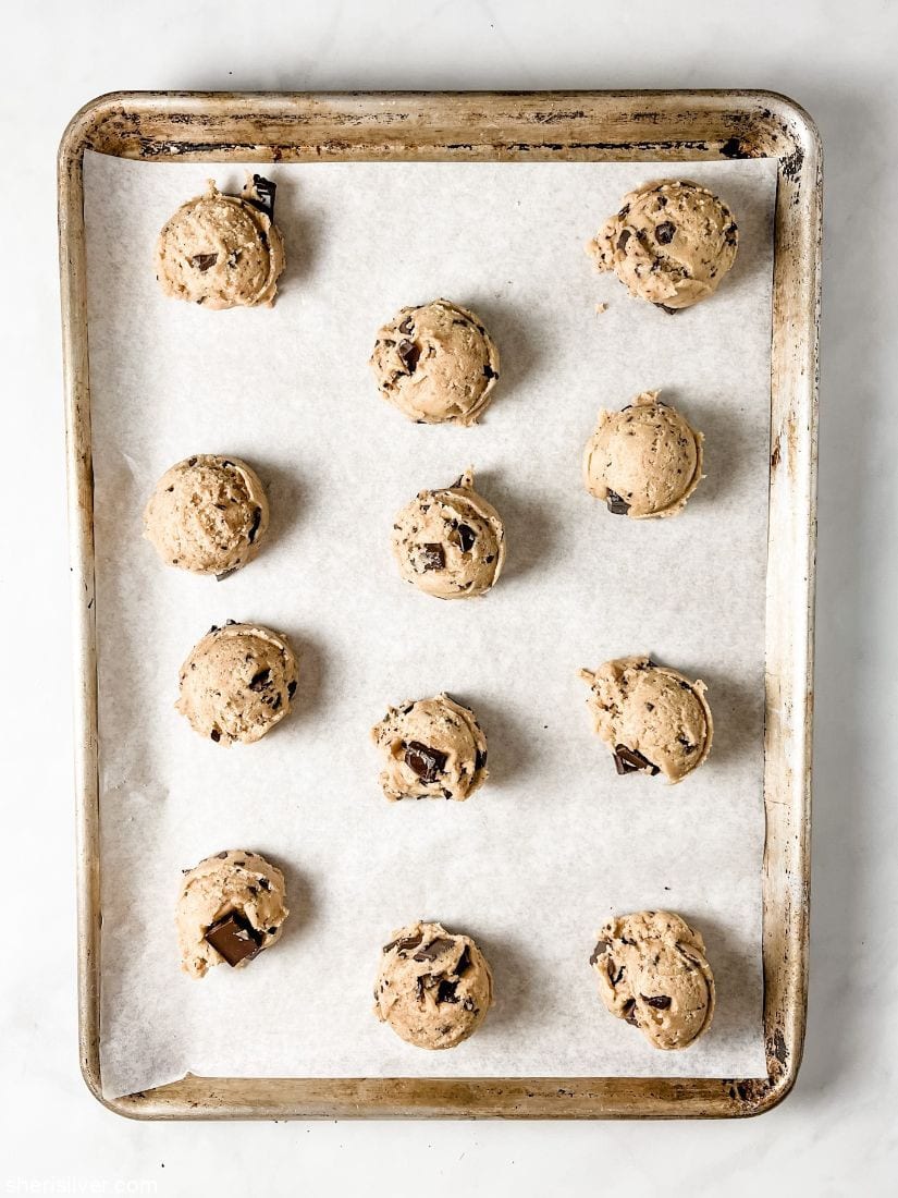 chocolate chunk cookie dough on a baking sheet