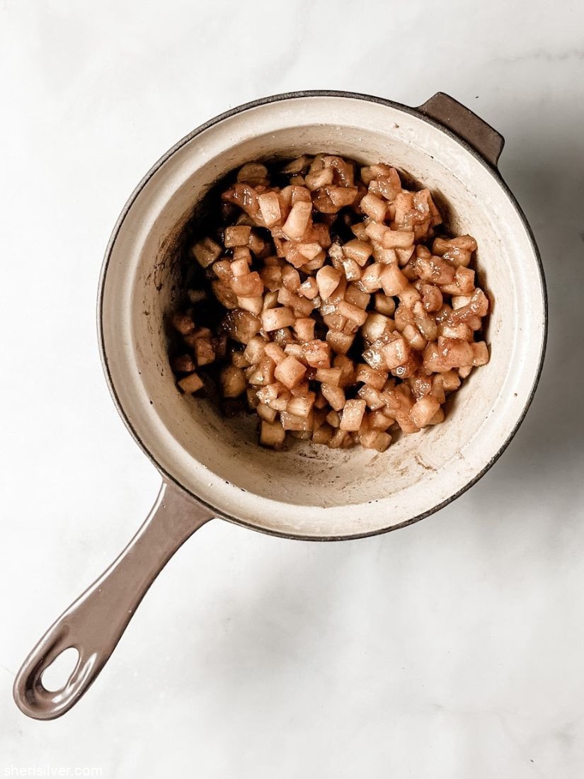 cooked diced apples in a vintage ceramic saucepan