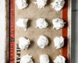 meringues on a silpat lined baking sheet