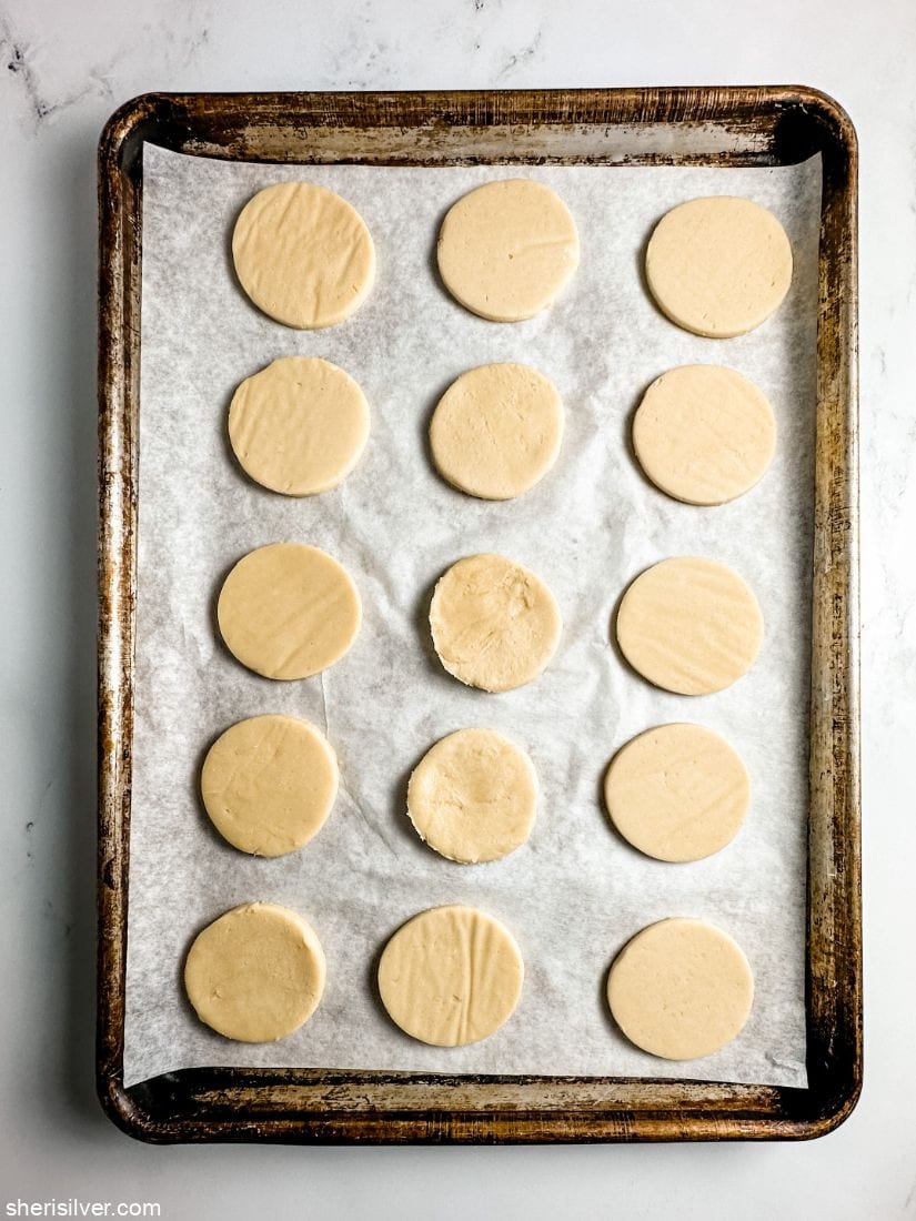 hamantaschen dough circles on a baking sheet
