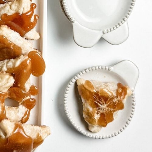 creme brulee hamantaschen on white ceramic tray and plate