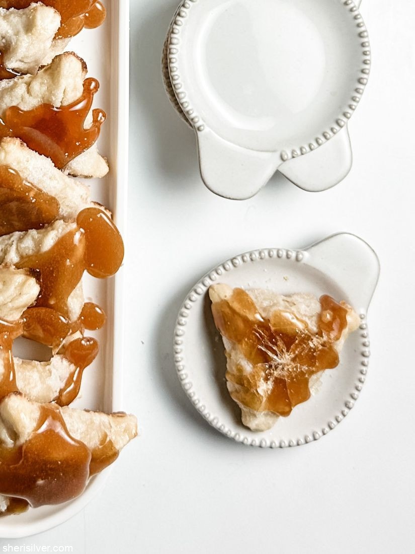 creme brulee hamantaschen on white ceramic tray and plate