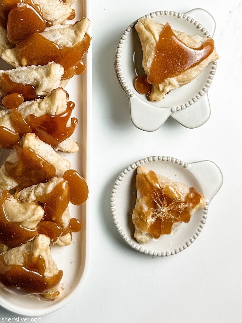creme brulee hamantaschen on white ceramic tray and plate