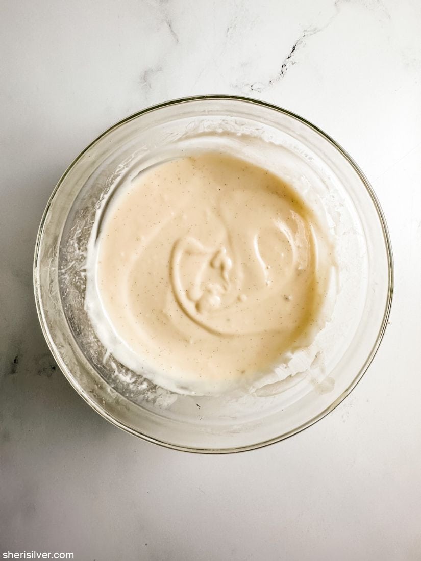 vanilla bean pudding in a glass bowl