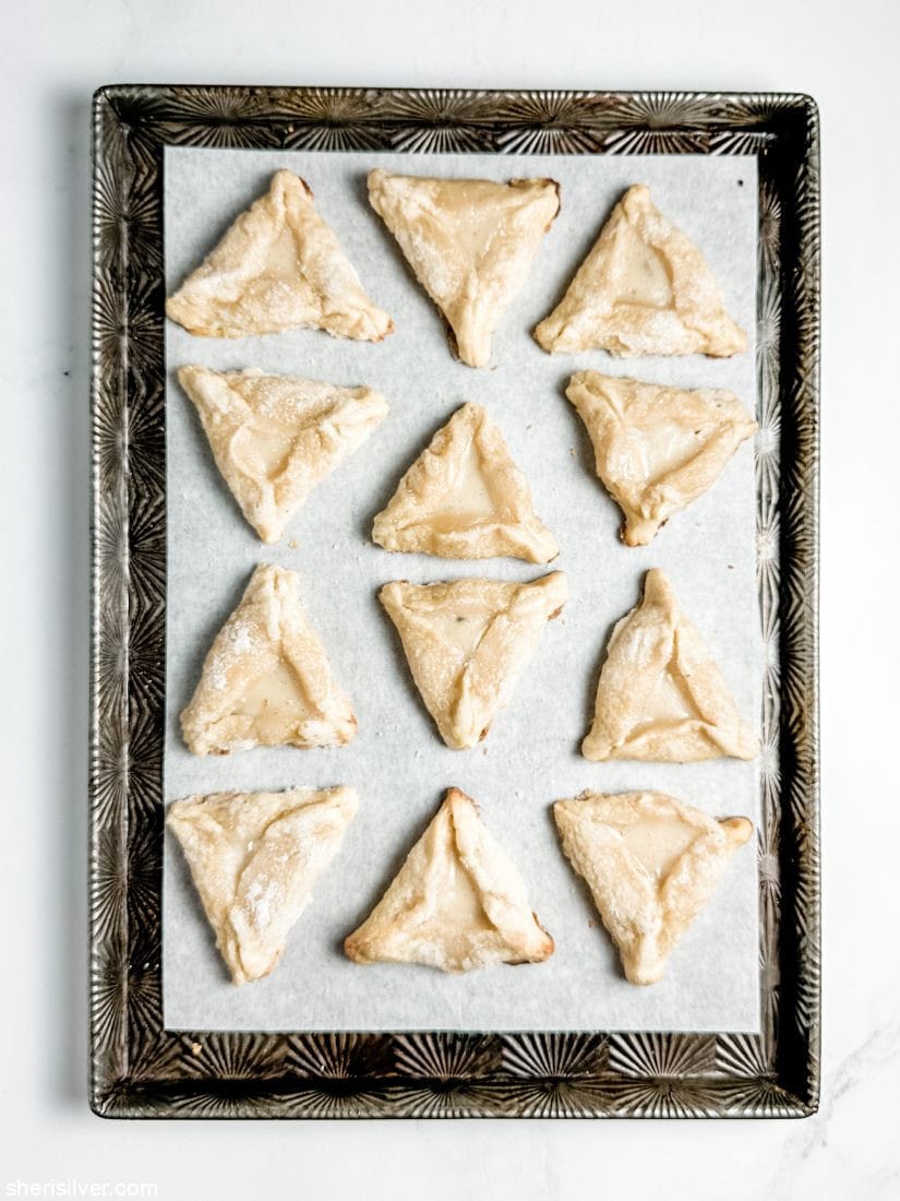 creme brulee hamantaschen on a baking sheet
