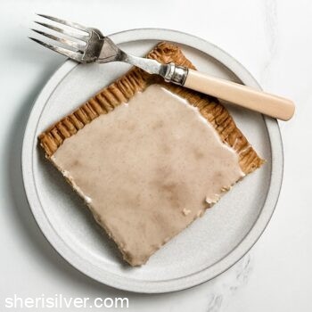 brown sugar slab pie on a white ceramic plate with vintage fork