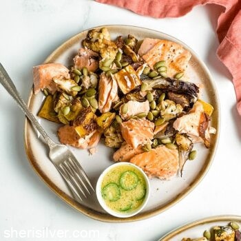 roasted salmon and vegetables with citrus miso on a ceramic plate