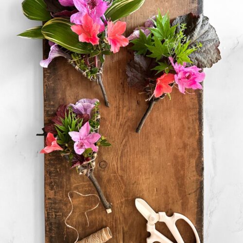 nature weavings on a wooden board