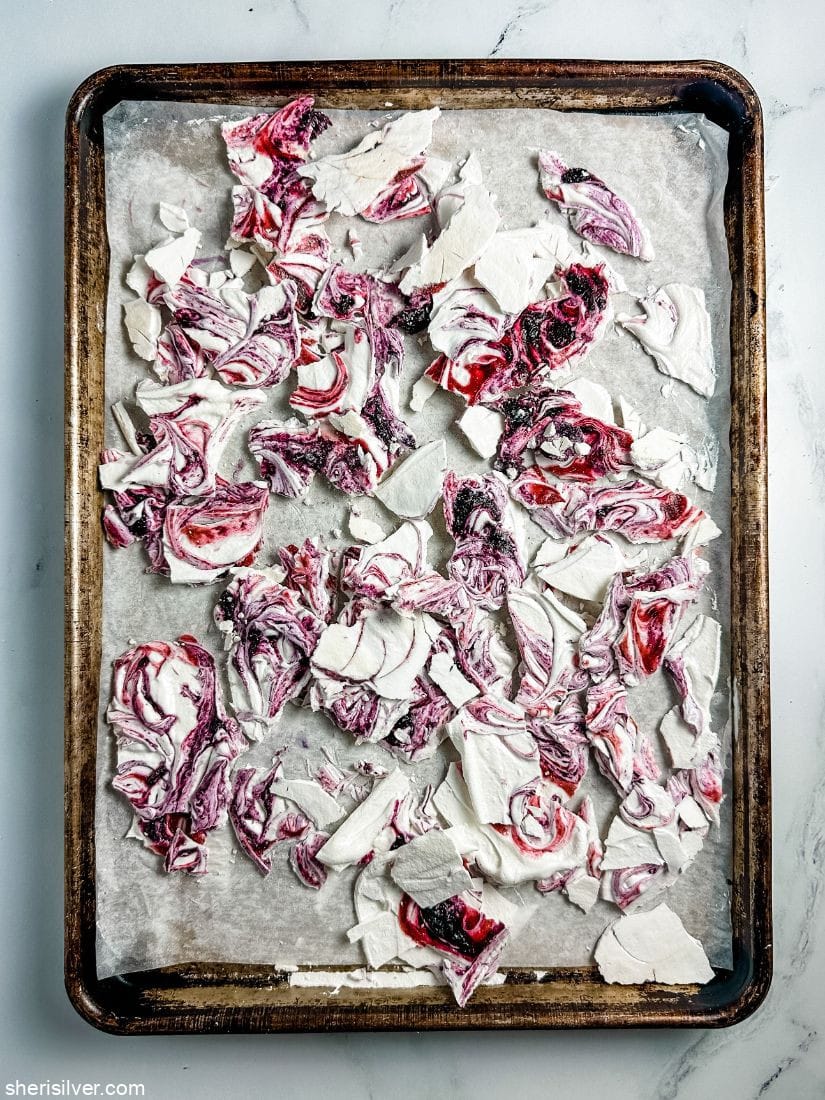 mixed berry meringue bark on a baking sheet