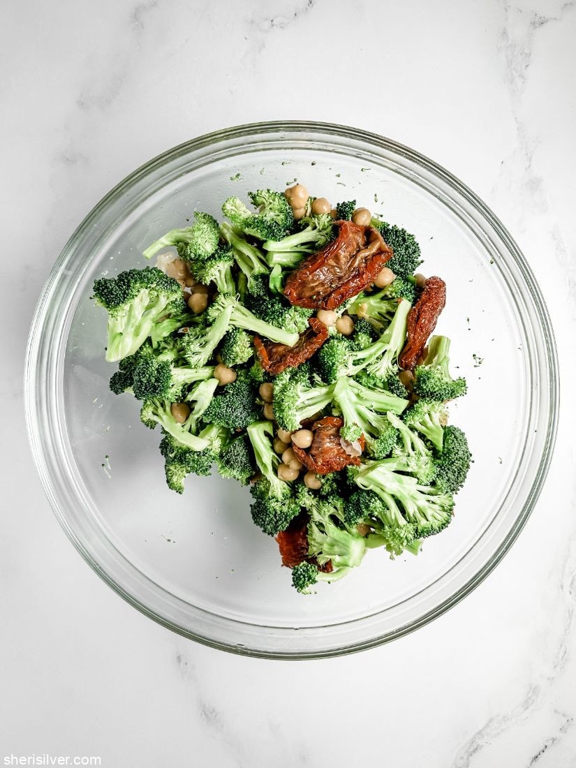 broccoli chickpeas and sundried tomatoes in a glass bowl