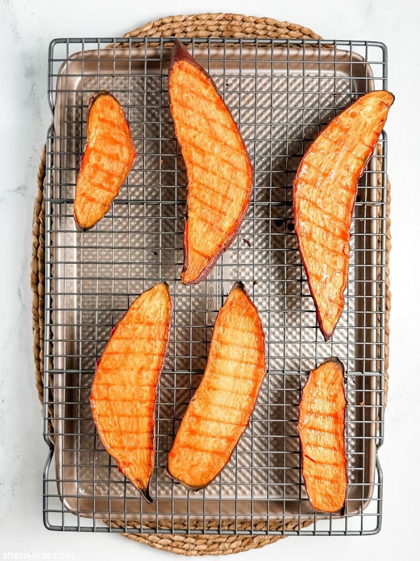 roasted sweet potato slices on a wire rack set over a baking sheet