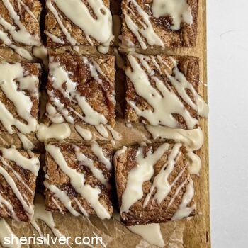apple butter bars on a parchment lined wooden board